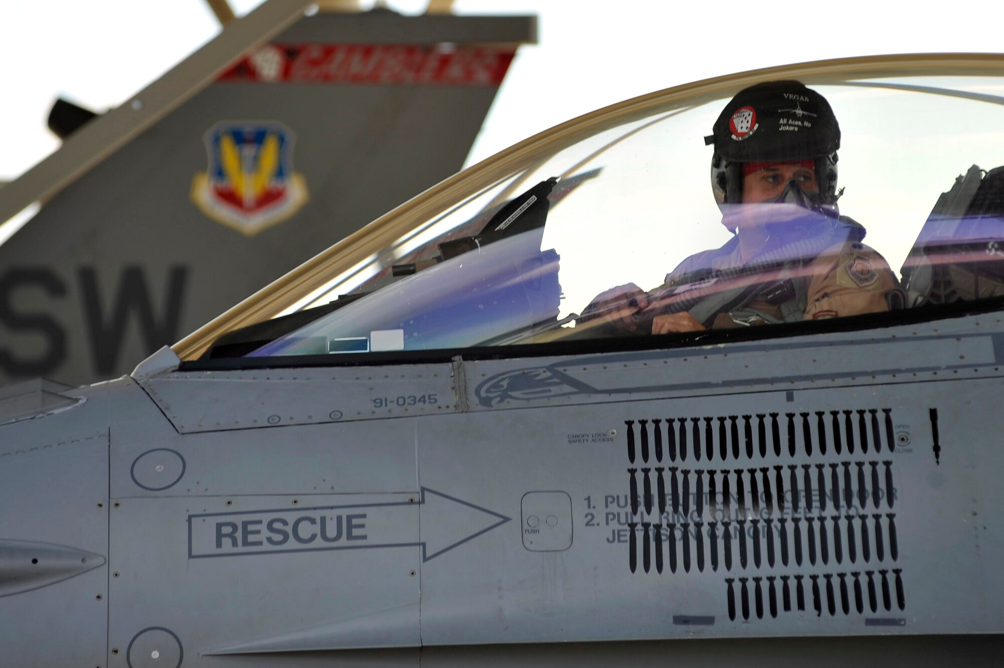 U.S. Air Force Lt. Col. John Vargas, 77th Fighter Squadron commander, talks with a crew chief before exiting his F-16 Fighting Falcon upon return from a five-month deployment in support of Operation Unified Protector, Shaw Air Force Base, S.C., Sept. 12, 2011.  (U.S. Air Force photo by Senior Airman Kenny Holston/Released)


