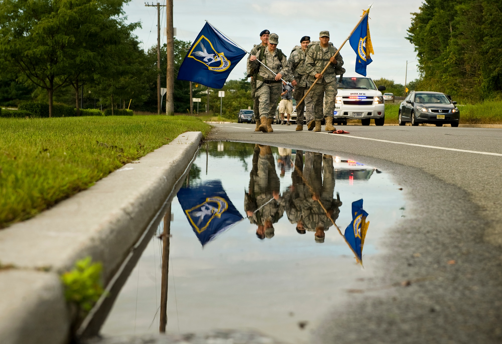 Security Forces airman from the 108th and 105th Security Forces Squadron from N.J. and N.Y. participate in the Security Forces 9/11 Ruck March to Remember in Denville, N.J., Sept. 10. More than 300 active-duty, Guard and Reserve Airmen from 23 units took turns marching from the Security Forces Center at Lackland Air Force Base, Texas, on July 12 to New York, handing off a guidon at each leg to honor the security forces members and Americans who died on 9/11 and in the ensuing wars. (U.S. Air Force photo/Tech. Sgt. Bennie J. Davis III)