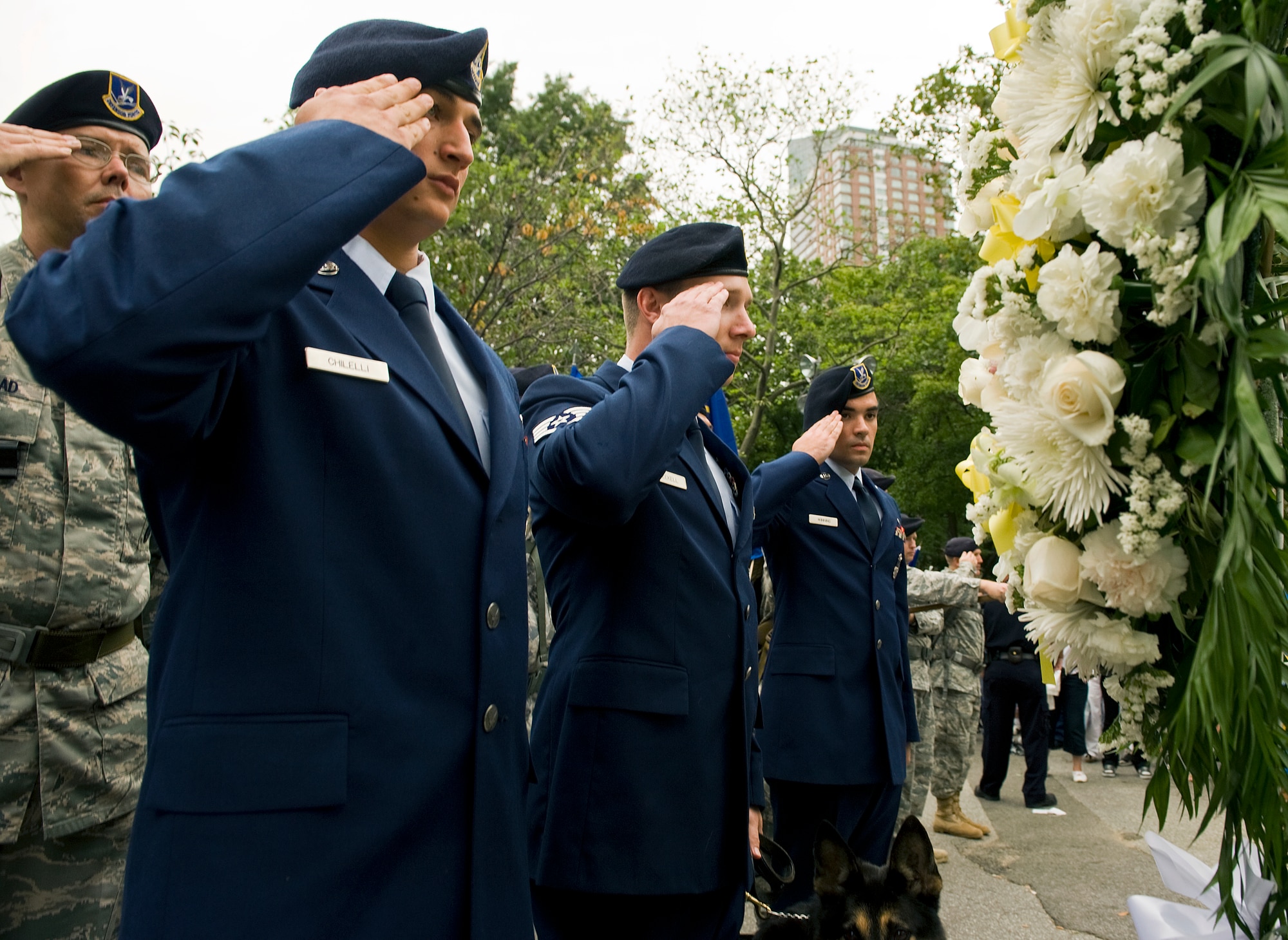 After two months and 2,100 miles of marching, U.S. Air Force Security Forces airmen give a solemn salute during a wreath laying ceremony in honor of the security forces defenders and Americans who died on 9/11 and in the ensuing wars at the culmination of the Security Forces 9/11 Ruck to Remember march in Battery Park, N.Y., Sept. 11. The last leg of their march began at the Intrepid Sea, Air and Space Museum and ended at Battery Park, where 2,796 flags covered the area to honor each person who died on 9/11.(U.S. Air Force photo/Tech. Sgt. Bennie J. Davis III)