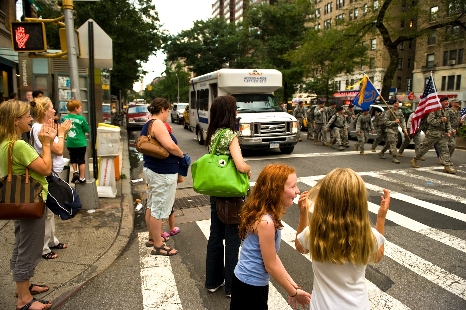 New Yorkers line the street cheering and clapping for U.S. Air Force Security Forces airman marching down Broadway Ave. in Manhatten during the Security Forces 9/11 Ruck to Remember, Sept. 10. (U.S. Air Force photo/Tech. Sgt. Bennie J. Davis III)