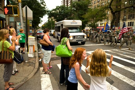 New Yorkers line the street cheering and clapping for U.S. Air Force Security Forces airman marching down Broadway Ave. in Manhatten during the Security Forces 9/11 Ruck to Remember, Sept. 10. (U.S. Air Force photo/Tech. Sgt. Bennie J. Davis III)