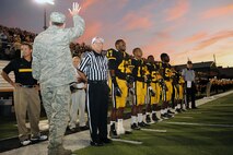 U.S. Air Force Col. Scott Kindsvater, 93rd Air Ground Operations Wing commander, waves at Valdosta High school football fans at Cleveland Field, Valdosta, Ga., Sept. 9, 2011. Kindsvater was the special guest of honor for military appreciation night, which allowed military members and their families free entry to the game (U.S. Air Force photo by Senior Airman Ciara Wymbs/Released)  