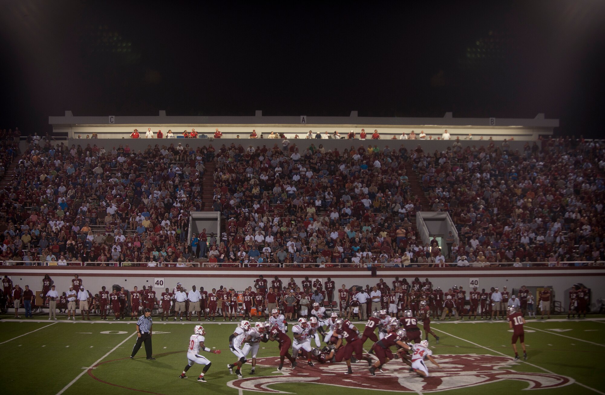 Friends, family, spectators and players for the Lowndes High-School Vikings watch as a play for a first down is made during the Lowndes High-School (LHS) Vikings and Tallahassee Leon Lions game at Martin Stadium, Valdosta, Ga., Sept. 9, 2011.  Randy McPherson has coached the Vikings since 1996. (U.S. Air Force photo by Airman 1st Class Joshua Green/Released)
