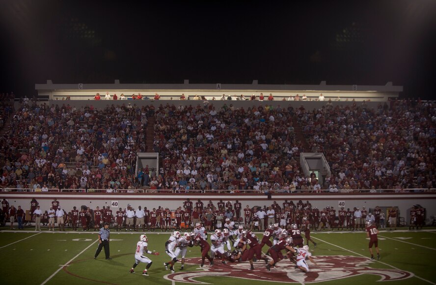 Friends, family, spectators and players for the Lowndes High-School Vikings watch as a play for a first down is made during the Lowndes High-School (LHS) Vikings and Tallahassee Leon Lions game at Martin Stadium, Valdosta, Ga., Sept. 9, 2011.  Randy McPherson has coached the Vikings since 1996. (U.S. Air Force photo by Airman 1st Class Joshua Green/Released)
