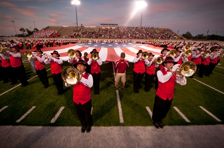 The Georgia Bridgemen band of Lowndes High School play the National Anthem before the start of the Lowndes High School Vikings and Tallahassee Leon Lions football game at Martin Stadium, Valdosta, Ga., Sept. 9, 2011. The Georgia Bridgemen have entertained thousands in venues ranging from high school football stadiums to the Georgia Dome as well as performing for presidents, governors and supreme court justices. (U.S. Air Force photo by Airman 1st Class Joshua Green/Released)
