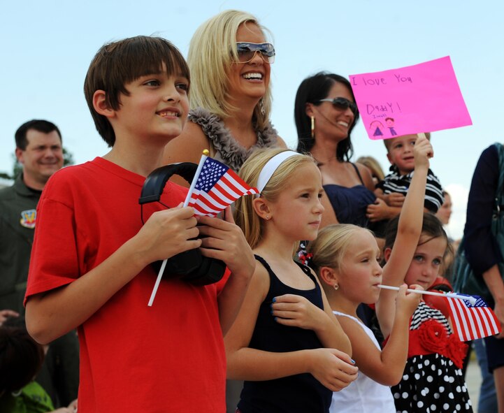 Families welcome their fathers and husbands home to Shaw Air Force Base, S.C. Sept. 12, 2011. The 77th Fighter Squadron returned from a deployment after providing air suppression and destruction of enemy defenses. (U.S. Air Force photo/Airman 1st Class Tabatha L. Duarte)(Released)