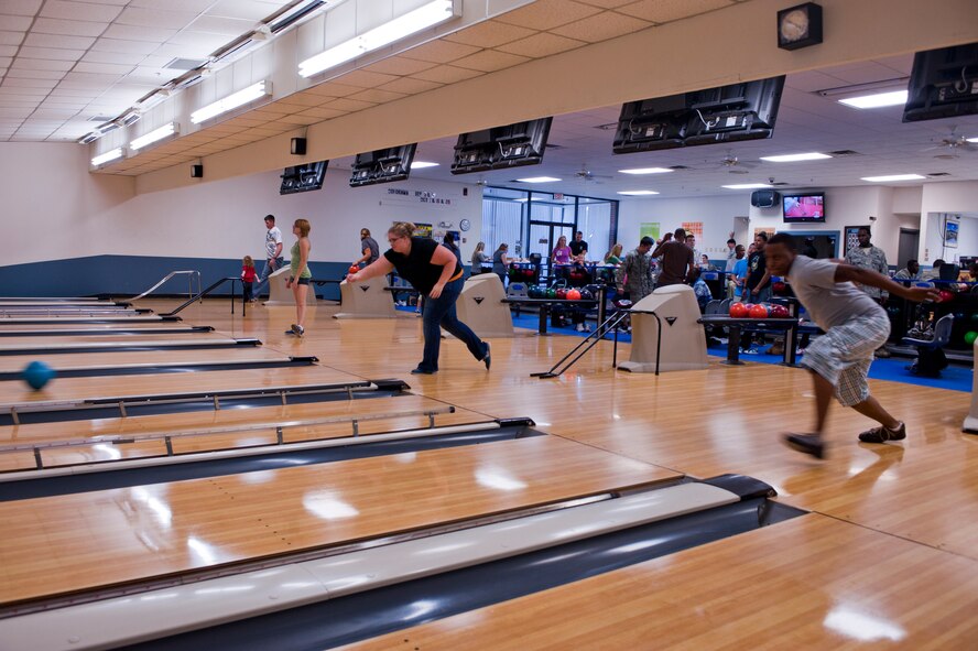 Team Moody members bowl for free during the grand opening of "The Spot" on Moody Air Force Base, Ga., Sept. 9, 2011. The Spot which is attached to the bowling facility offers a wide array of entertainment, ranging from bowling, karaoke and video games. The new facility is open to all ID card holders and their guests. (U.S. Air Force photo by Staff Sgt. Joshua J. Garcia/Released)  