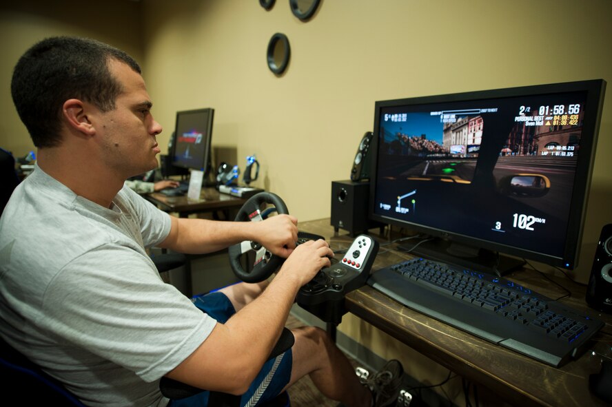 U.S. Air Force Senior Airman Bryant Guardia, 23rd Logistic Readiness Squadron, plays a video game on one of the many computers rigged for gaming at the grand opening of "The Spot" on Moody Air Force Base, Ga., on Sept. 9, 2011. The Spot has multiple gaming rooms that consist of state of the art gaming computers as well as the most recent gaming consoles on the market. (U.S. Air Force photo by Staff Sgt. Joshua J. Garcia/Released)