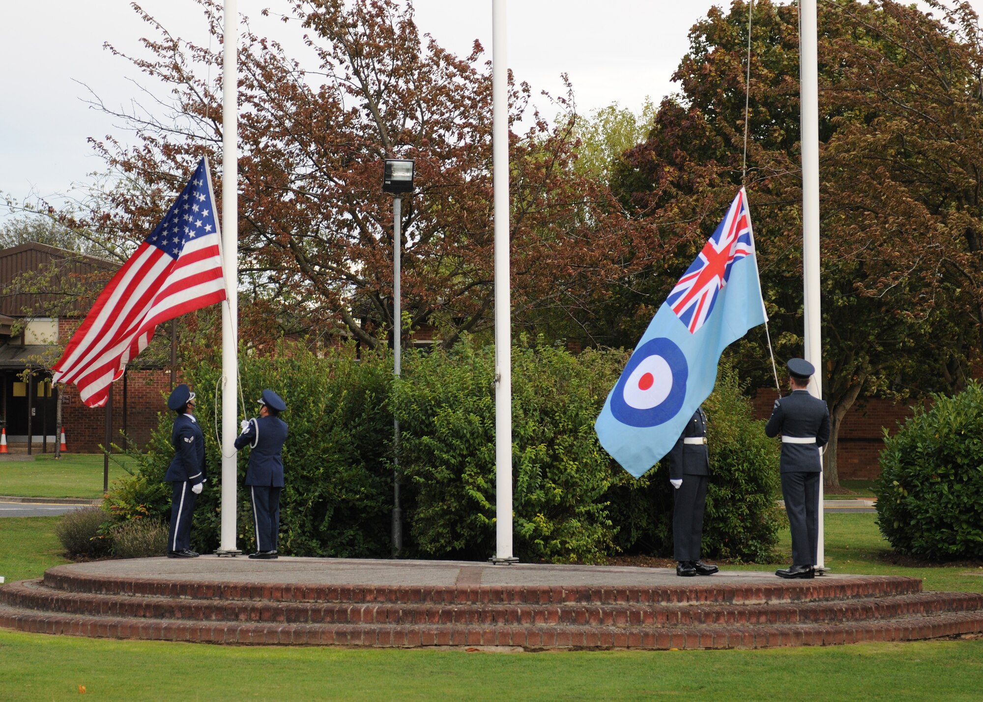 RAF ALCONBURY, United Kingdom - Airmen from the 423rd Air Base Group and Royal Air Force retire the colors during a commemoration of the 71st anniversary of The Battle of Britain Sept. 7 here. (U.S. Air Force photo by Tech. Sgt. John Barton)