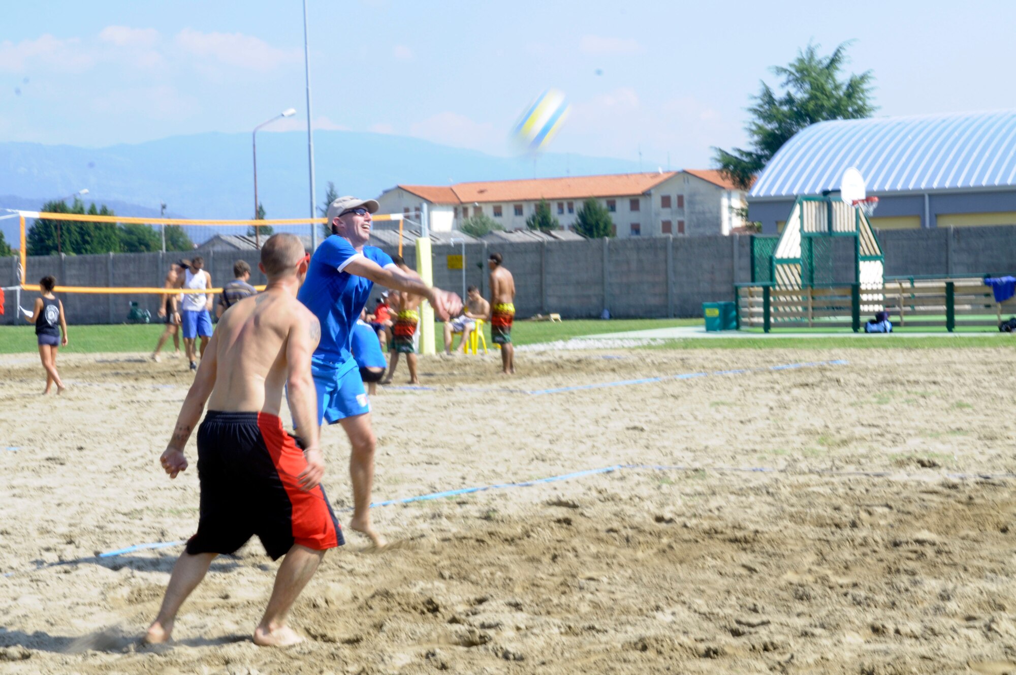 Participants of the Italian-American Friendship Festival play a game of volleyball Sept. 10 in Maniago, Italy. (U.S. Air Force photo/2nd Lt. Joseph Alonso)