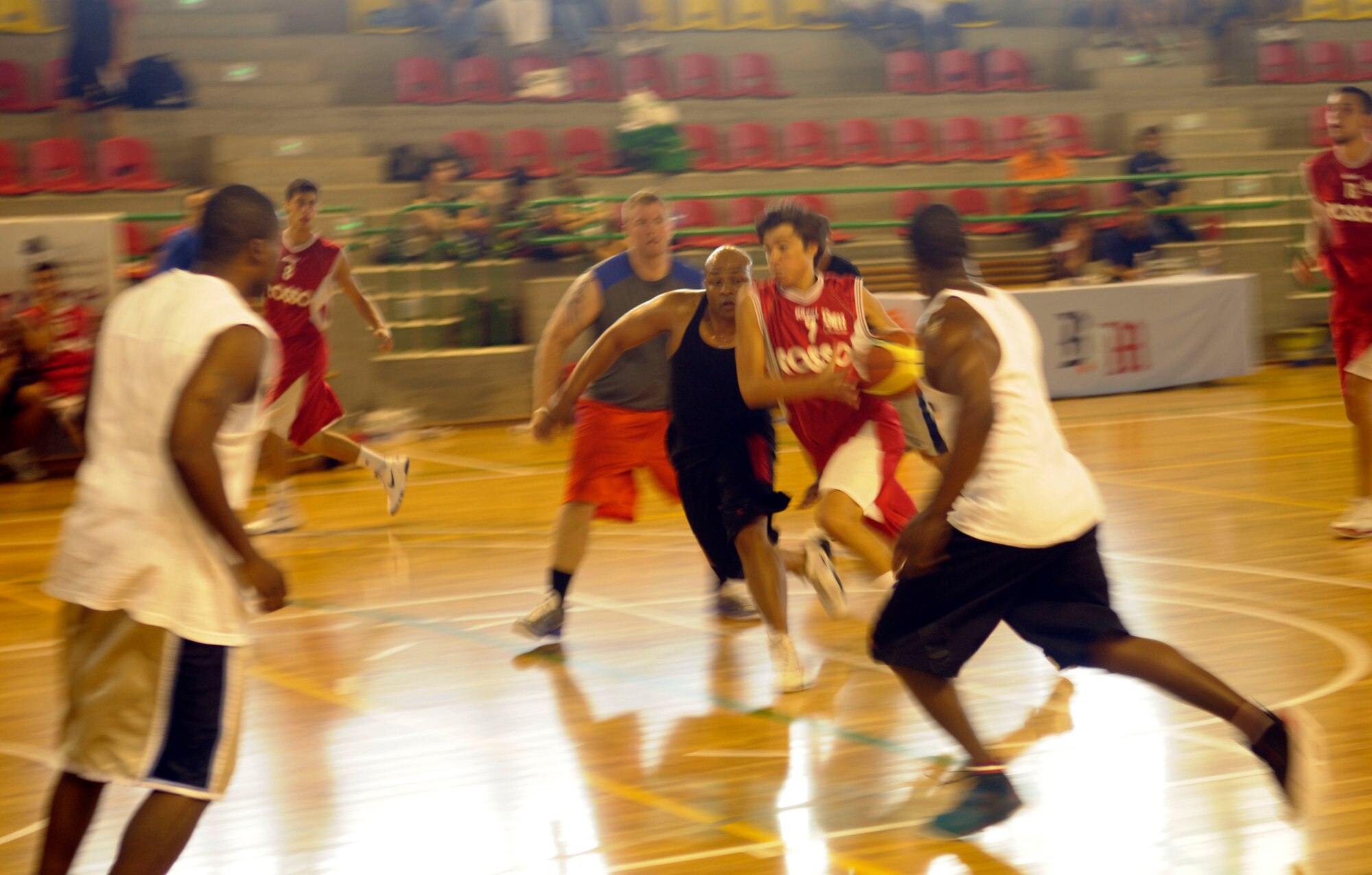 Players from the 31st Fighter Wing and the local community play a game of basketball during the Italian-American Friendship Festival Sept. 10 in Maniago, Italy. (U.S. Air Force photo/2nd Lt. Joseph Alonso)