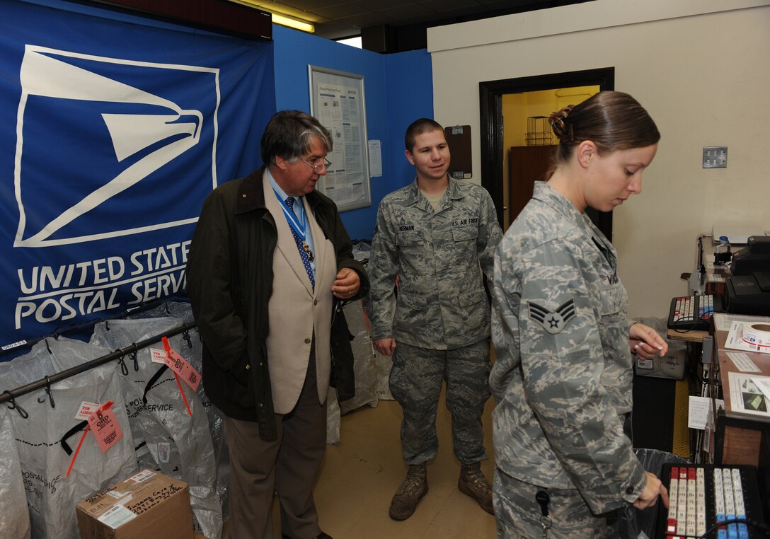 RAF ALCONBURY, United Kingdom - Richard Barnwell, the High Sheriff of Cambridgeshire, visits with Airmen from the Post Office during a brief visit Sept. 8. (U.S. Air Force photo by Tech. Sgt. John Barton)