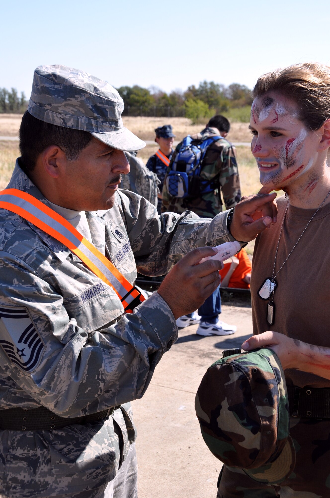 Senior Master Sgt.Tony Navarro, 301st Medical Squadron technician, applies moulage to Civil Air Patrol cadet Jessica Bearden in preparation for the joint Mass Casualty Exercise held at the Army Reserve Center, Fort Worth, September 10 and 11. CAP cadets acted as injured personnel during the two-day exercise which pulled together military and civilian units and emergency responders from around the area.  (U.S. Air Force photo/Staff Sgt Chris Bolen)