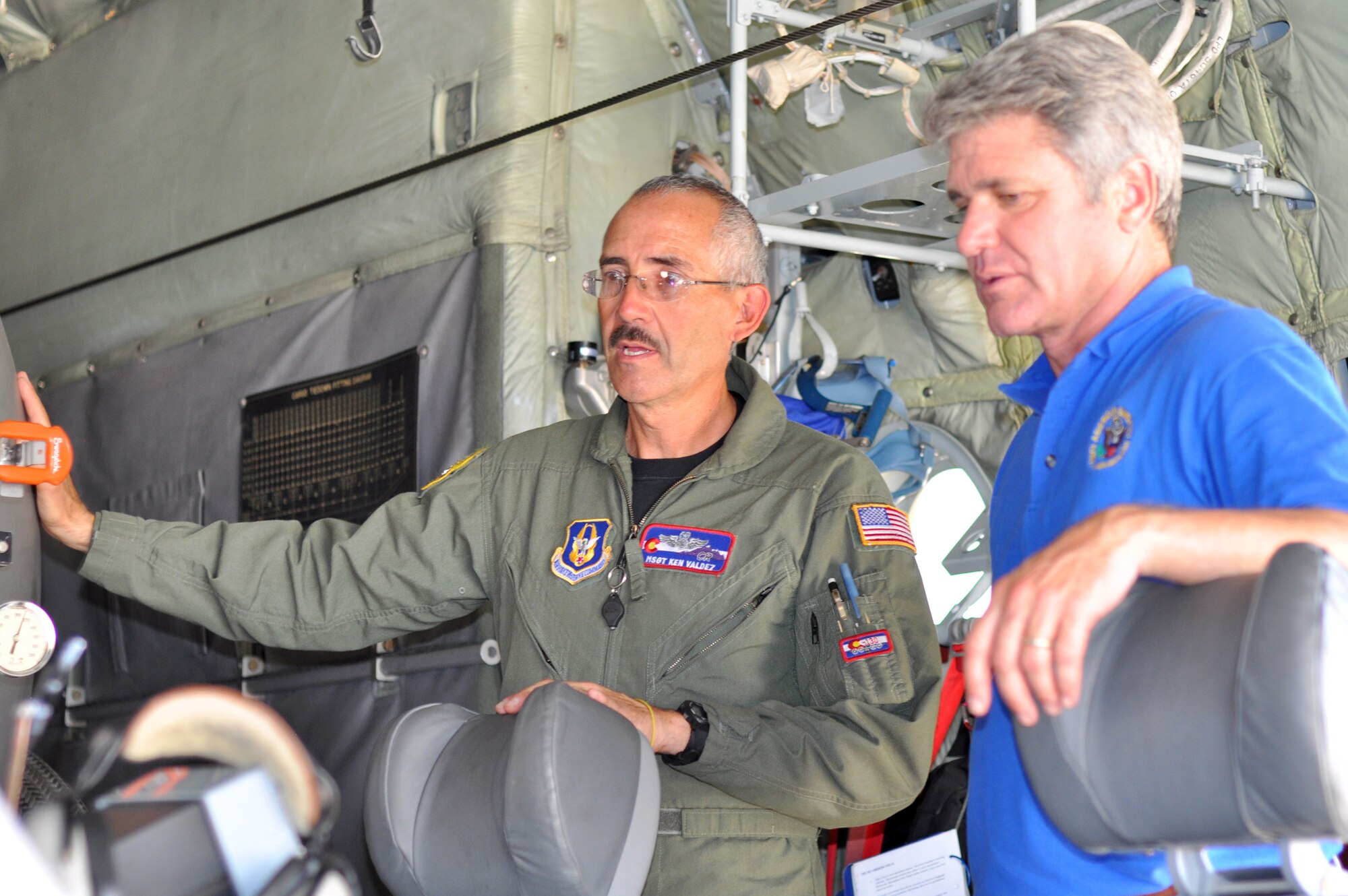 Air Force Reserve Master Sgt. Ken Valdez explains the inner workings of the Modular Airborne Fighting System, or "MAFFS" II, to Congressman Michael McCaul Sept. 11 at the Austin-Bergstrom International Airport in Austin, Texas. The congressman, who represents the 10th District of Texas, received a first-hand look at both civilian and military aerial firefighting aircraft and spoke with the Airmen assigned to the 302nd Air Expeditionary Group about their role in the Modular Airborne Firefighting System mission. Texas's 10th District stretches from Austin to the western outskirts of Houston. (U.S. Air Force photo/Staff Sgt. Stephen J. Collier)