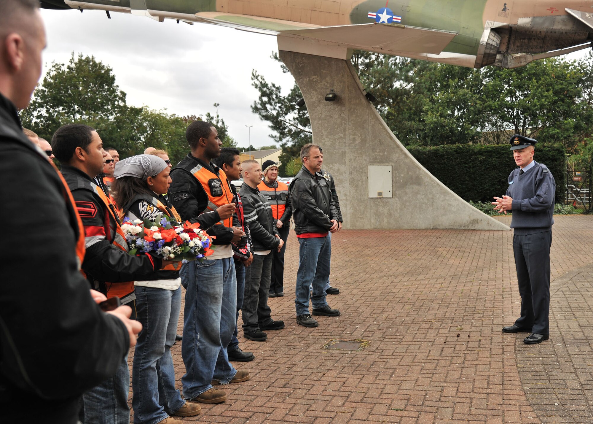 RAF MILDENHALL, England – Squadron Leader Rick Fryer, RAF Mildenhall Station commander, addresses Airmen participating in the Prisoner of War/Missing in Action Rolling Thunder Remembrance Motorcycle Ride at Memorial Park on RAF Lakenheath Sept. 13, 2011. As part of POW/MIA Remembrance week, the 100th Air Refueling Wing is hosting several events including a luncheon and base retreat ceremony. (U.S. Air Force photo by Senior Airman Jerilyn Quintanilla)