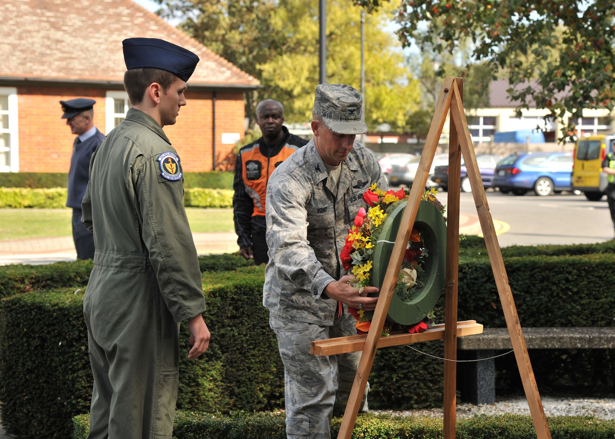 RAF MILDENHALL, England – Col. Kyle Voigt, 100th Air Refueling Wing vice commander, places a wreath on the Prisoner of War/Missing in Action memorial here Sept. 13, 2011. More than 50 Airmen participated in POW/MIA Rolling Thunder Remembrance Motorcycle Ride beginning on RAF Mildenhall and ending at Memorial Park on RAF Lakenheath. (U.S. Air Force photo by Senior Airman Jerilyn Quintanilla)