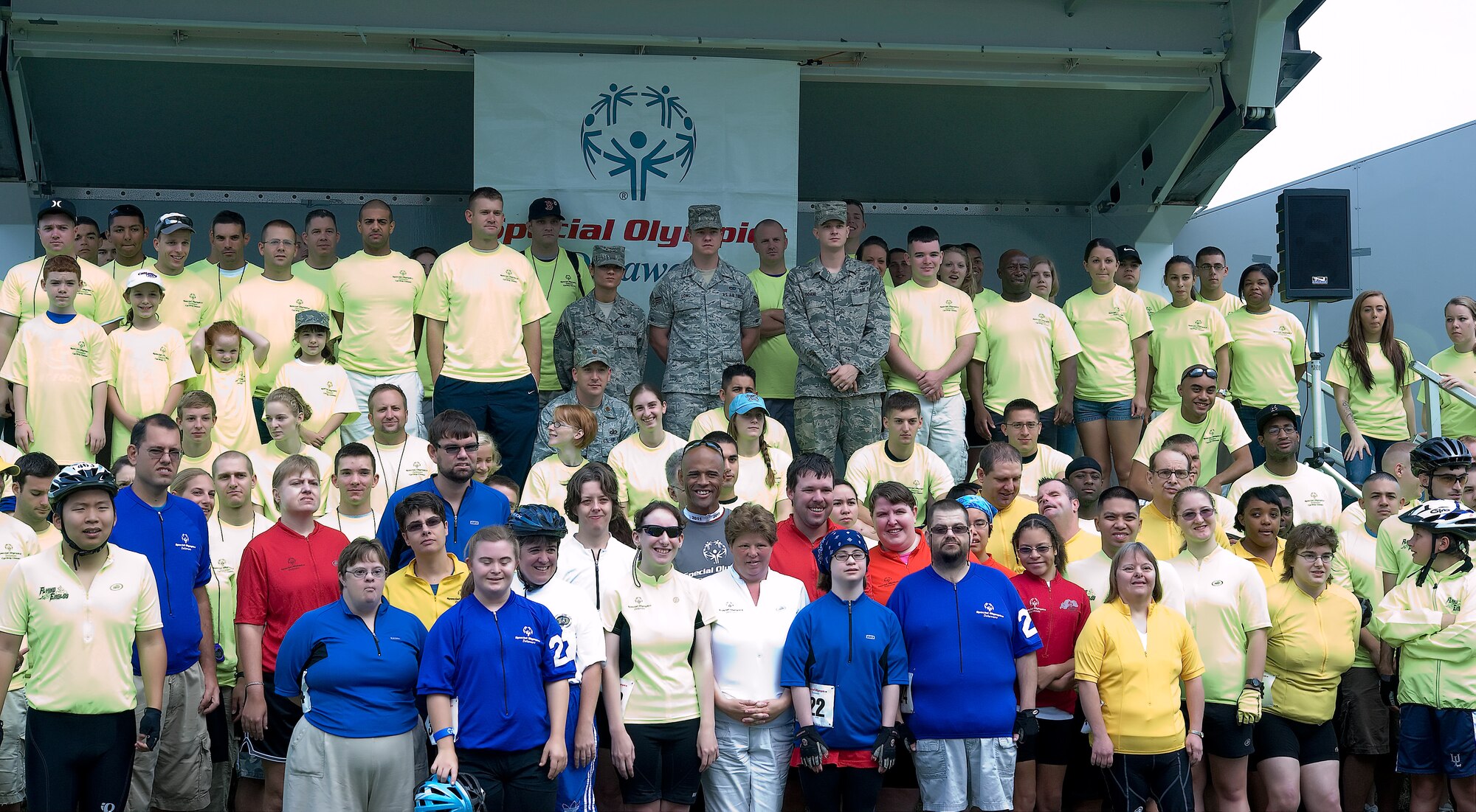 Participants and volunteers of Special Olympics Delaware gather for a group photograph before the games kick off Sept. 10, 2011, at Dover Air Force Base, Del. More than 100 volunteers came out to support the 35 competitors in the games. (U.S. Air Force photo by Kathryn Stilwell)