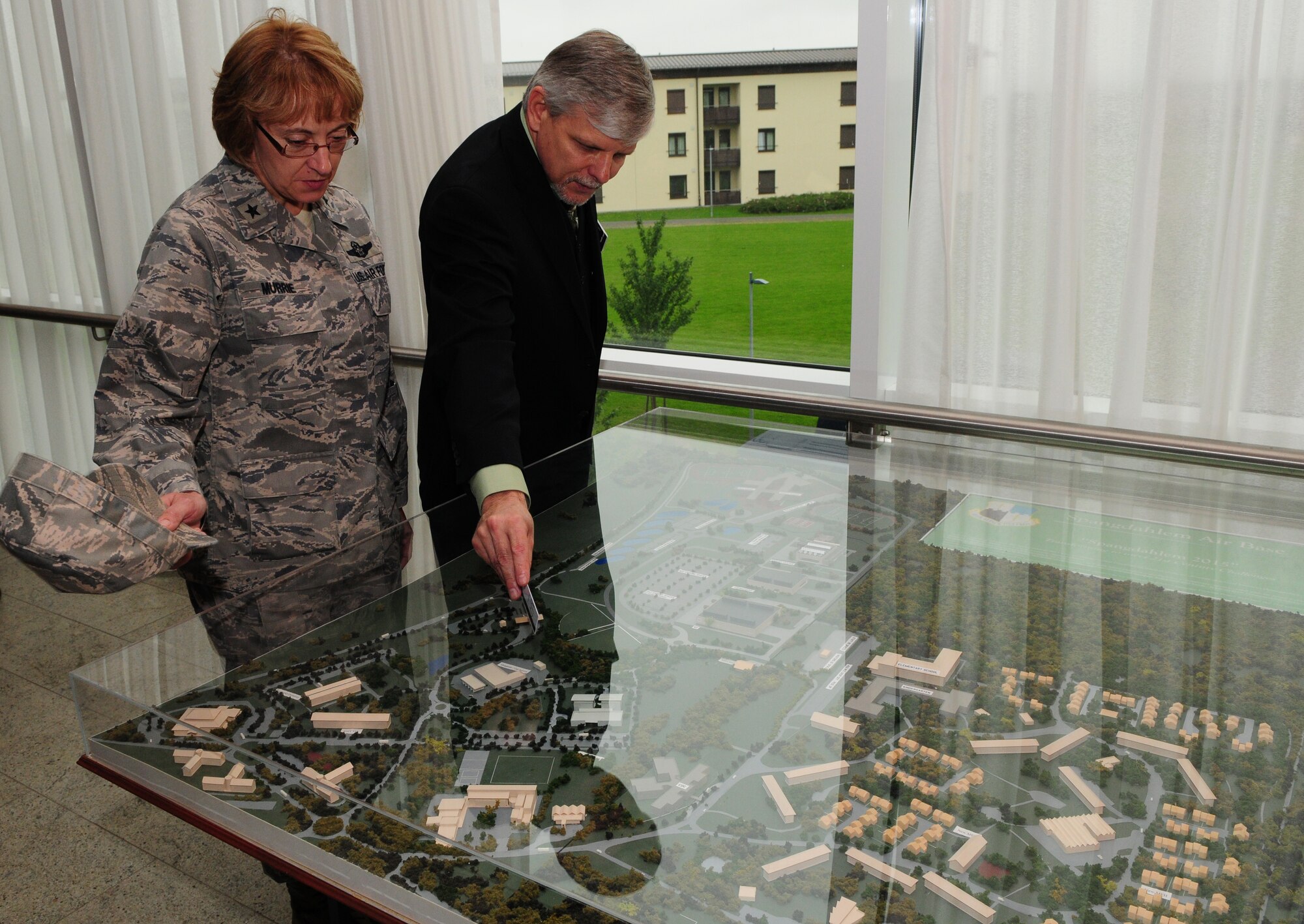 SPANGDAHLEM AIR BASE, Germany – Michael McGuire, 52nd Force Support Squadron Eifel Arms Inn general manager, shows Brig. Gen. Eden Murrie, director of Air Force Services, a model of the planned base expansion during her visit here Sept. 9. General Murrie visited various facilities and flights within the 52nd Force Support Squadron to familiarize herself with how the 52nd Fighter Wing takes care of its Airmen and their families. (U.S. Air Force photo/Airman 1st Class Matthew B. Fredericks)