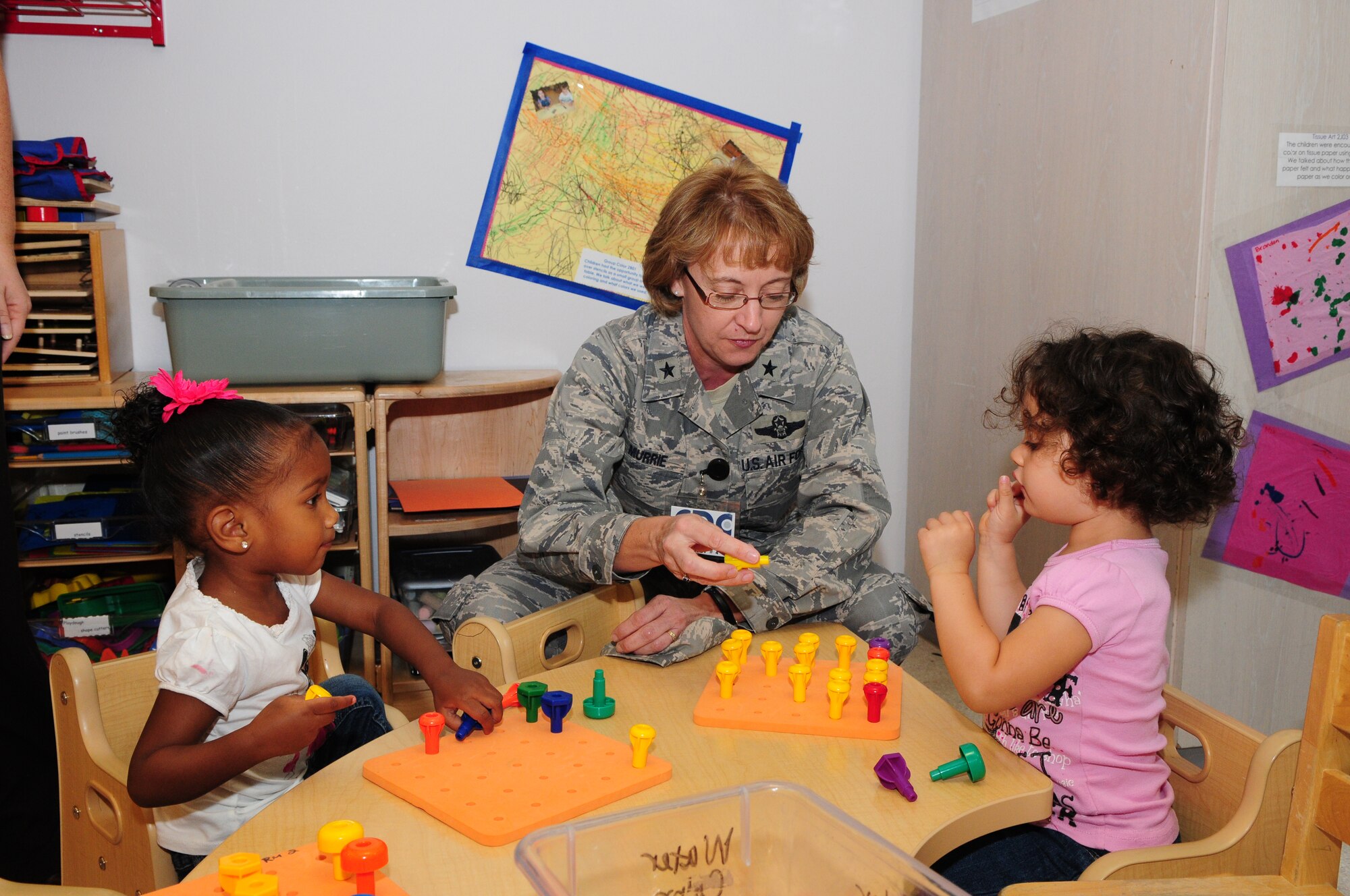 SPANGDAHLEM AIR BASE, Germany – Brig. Gen. Eden Murrie, director of Air Force Services, plays with some children during her visit to the child development center here Sept. 9. General Murrie visited various facilities and flights within the 52nd Force Support Squadron to familiarize herself with how the 52nd Fighter Wing takes care of its Airmen and their families. (U.S. Air Force photo/Airman 1st Class Matthew B. Fredericks)