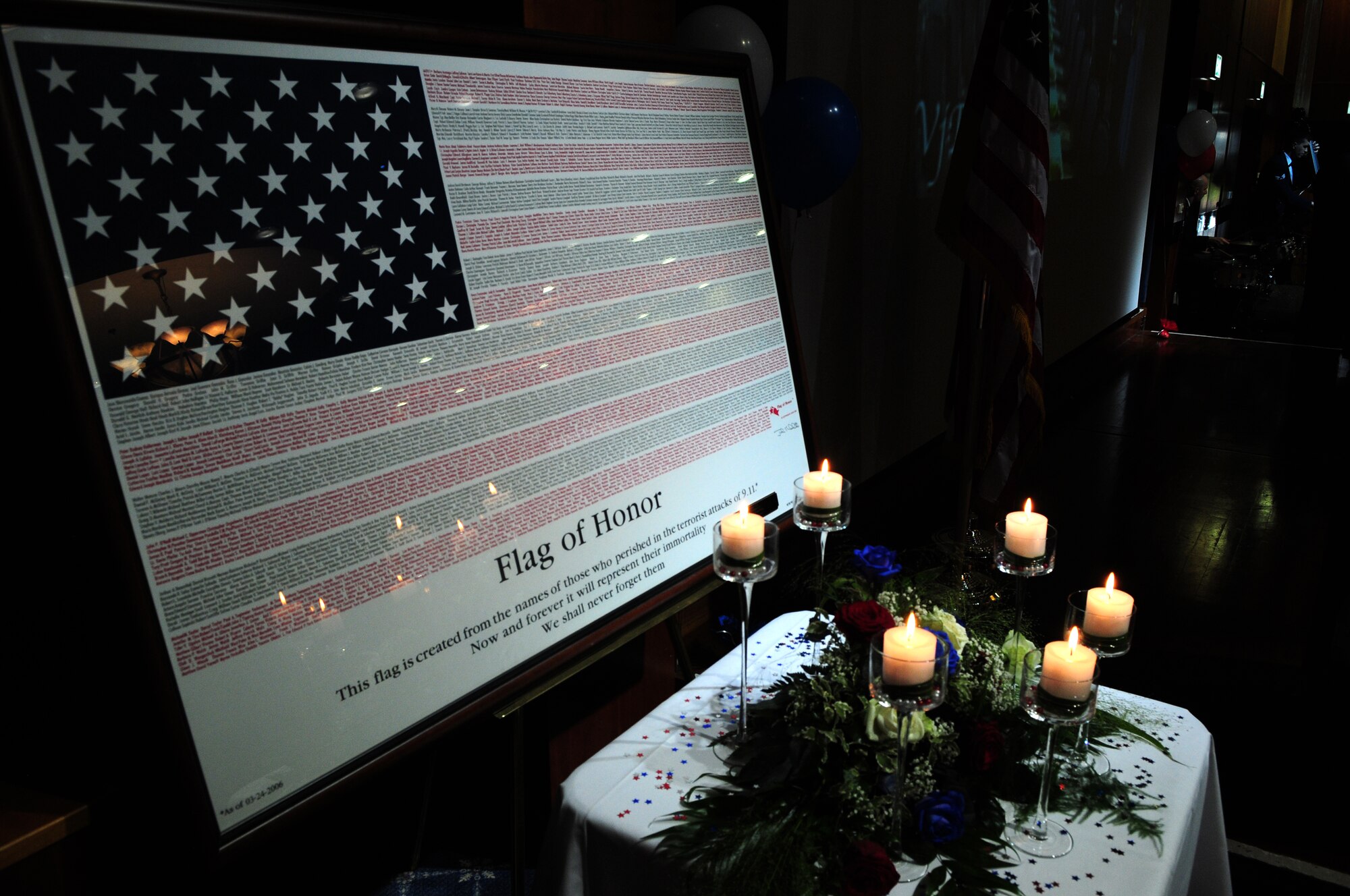 SPANGDAHLEM AIR BASE, Germany – A flag of honor sits on display during the 2011 Air Force Ball Sept. 10 at Club Eifel. The flag is made up of the names of those who died Sept. 11, 2001 as a remembrance of the victims. Saber Airmen from across the 52nd Fighter Wing were invited to attend the event, which celebrated the Air Force's birthday and Airmen’s contributions to the current fight. (U.S. Air Force photo/Airman 1st Class Matthew B. Fredericks)