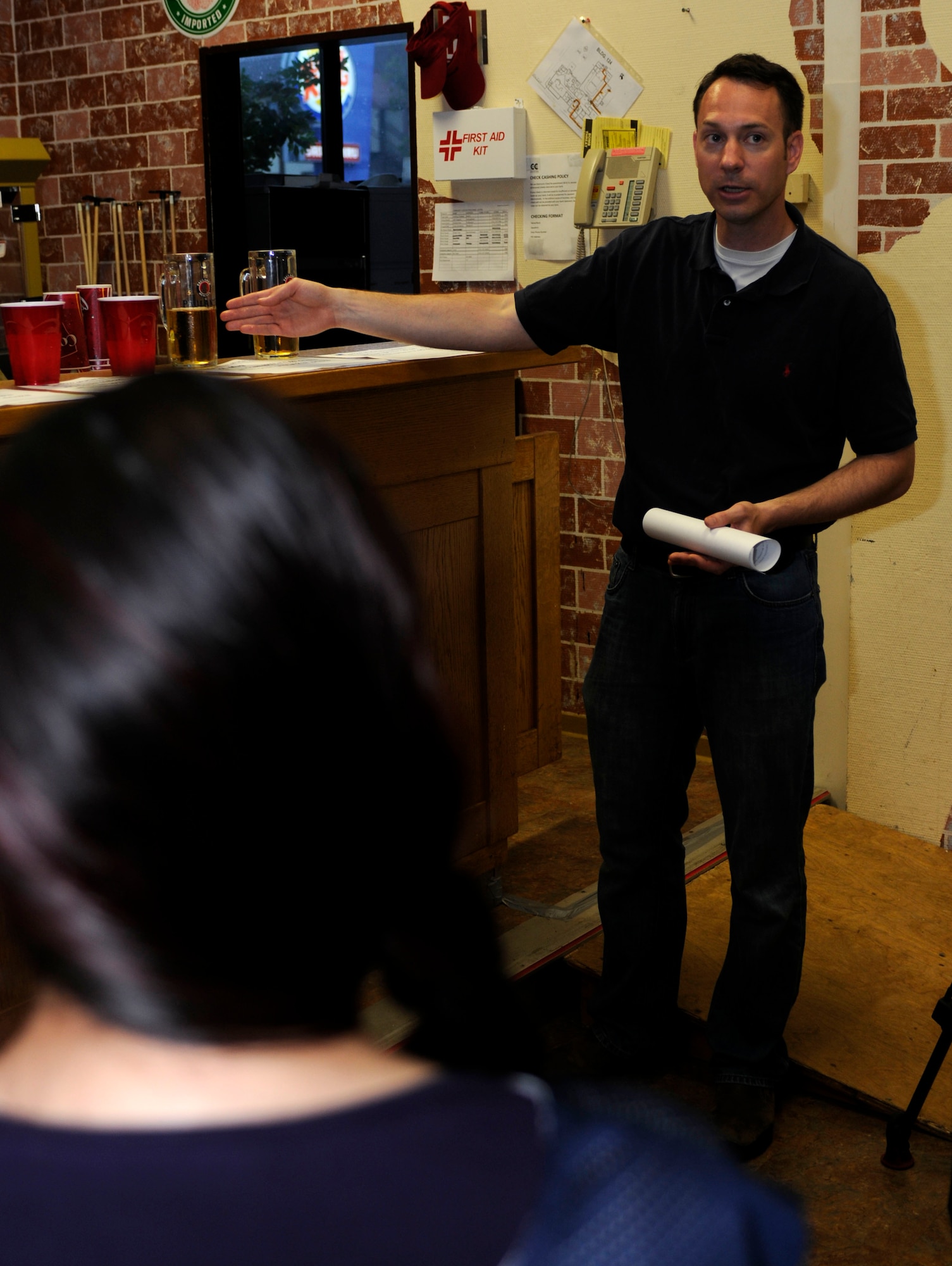 SPANGDAHLEM AIR BASE, Germany -- Major Nathan Maertens, 52nd Aerospace Medical Squadron, instructs Airmen on how many alcoholic drinks are counted in one glass of beer during an alcohol awareness class Sept. 10 at the Brick House. This class gave Airmen a firsthand understanding of how alcohol affects their abilities. They also learned how to accurately count how much alcohol they consume.  Airmen who participated in the class drank one alcoholic drink an hour, not to exceed five, and participated in exercises testing their cognitive thinking, reaction time and balance. Airmen also participated as designated drivers for those drinking. (U.S. Air Force photo/ Senior Airman Natasha Stannard)