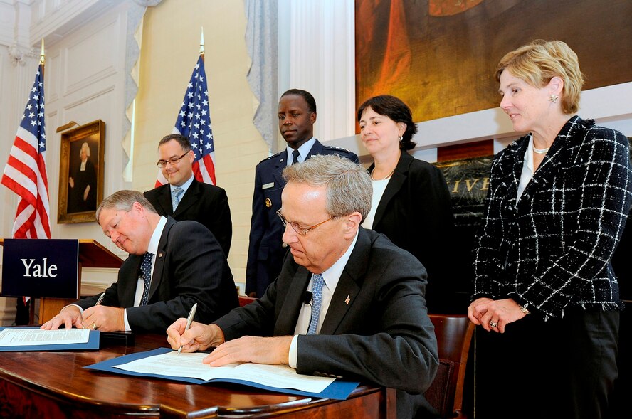 Secretary of the Air Force Michael Donley and Yale University president Richard Levin sign an agreement Sept. 12, 2011, to establish an Air Force ROTC detachment at Yale during a signing ceremony at the university's Woodbridge Hall. Classes for cadets will begin on Yale's campus in the fall of 2012. (U.S. Air Force photo/Scott M. Ash) 