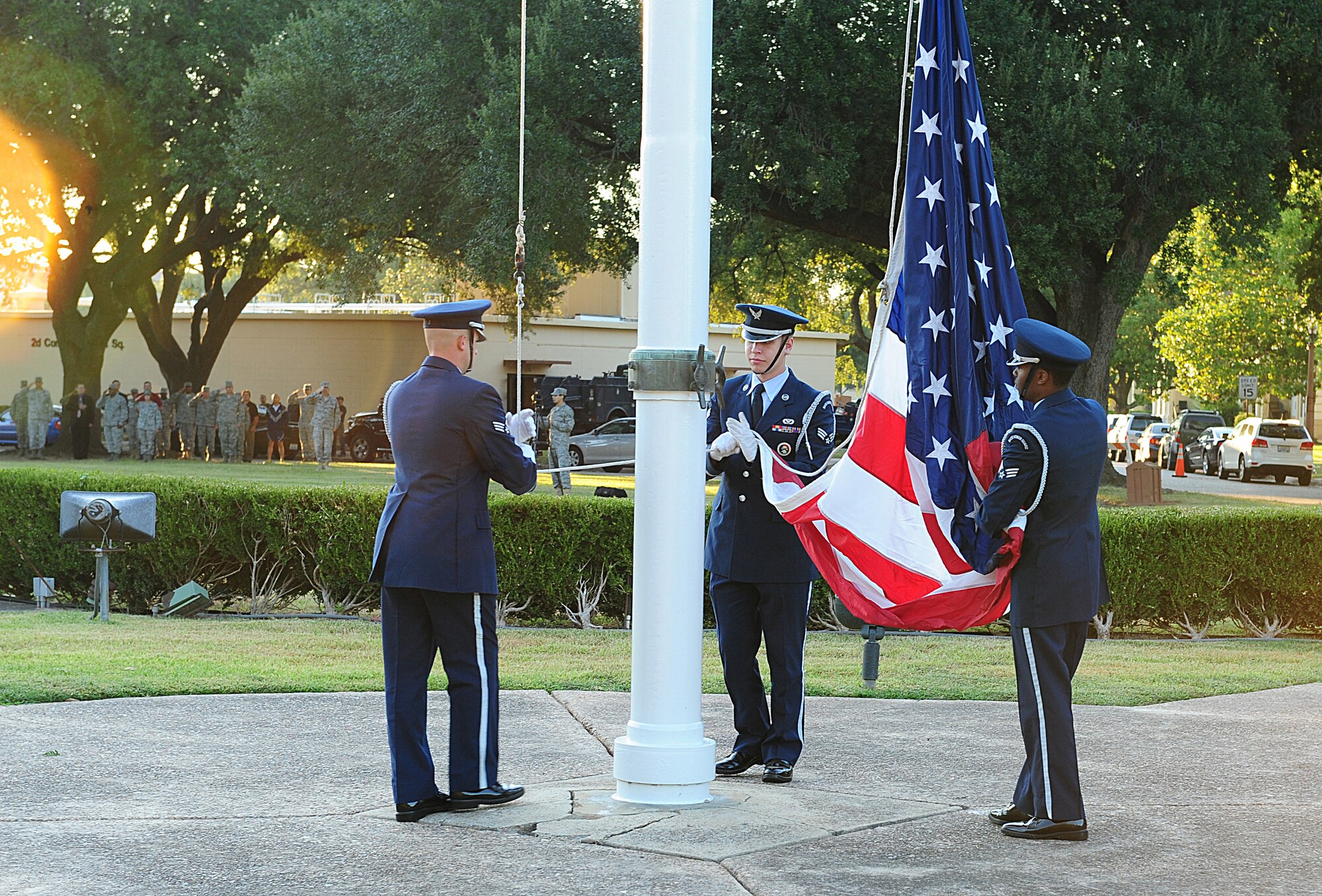 Members of the base Honor Guard raise the American flag during the National Anthem on Barksdale Air Force Base, La., Sept. 9. The Honor Guard prepared and raised the flag during the ceremony to honor the 10th anniversary of the 9/11 terrorist attacks. (U.S. Air Force photo/Airman 1st Class Benjamin Gonsier)(RELEASED)