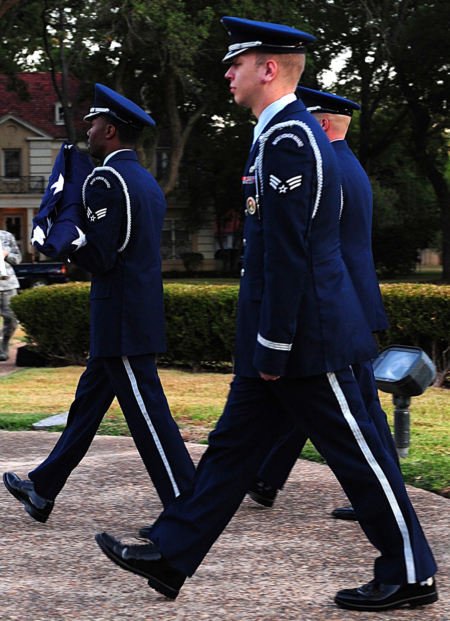 Members of the base Honor Guard raise the American Flag during the National Anthem on Barksdale Air Force Base, La., Sept. 9. The Honor Guard prepared and raised the flag during the ceremony to honor the 10th anniversary of the 9/11 terrorist attacks. (U.S. Air Force photo/Airman 1st Class Benjamin Gonsier)(RELEASED)
