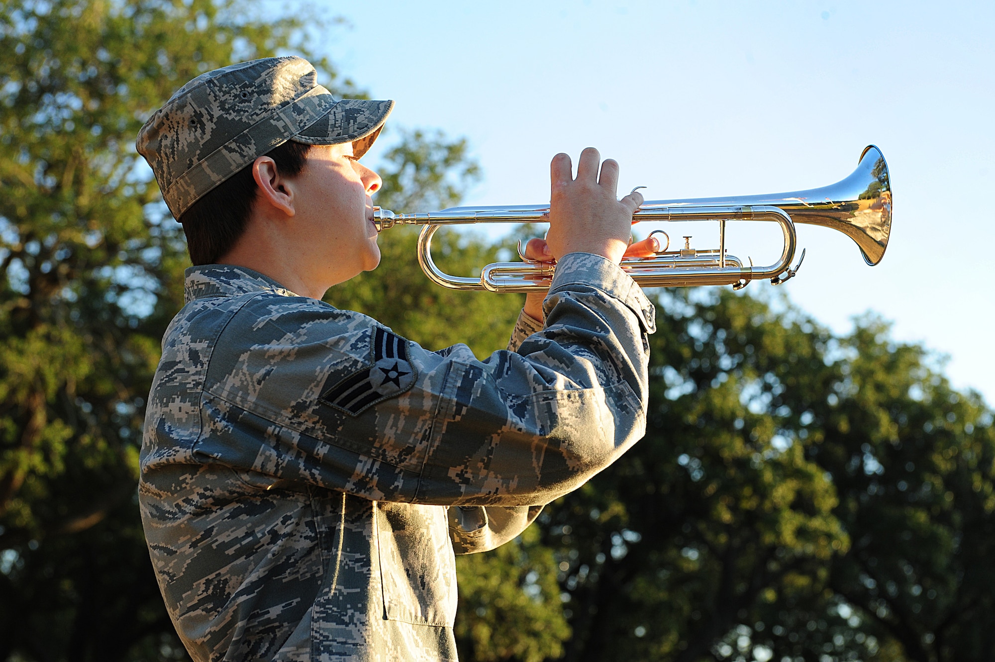 Senior Airman Heather Leithead, 2nd Maintenance Squadron, plays the trumpet on Barksdale Air Force Base, La., Sept. 9. Leithead performed Taps for the ceremony to remember the 10th anniversary of the terrorist attacks on U.S. soil in 2001. (U.S. Air Force photo/Airman 1st Class Benjamin Gonsier)(RELEASED)