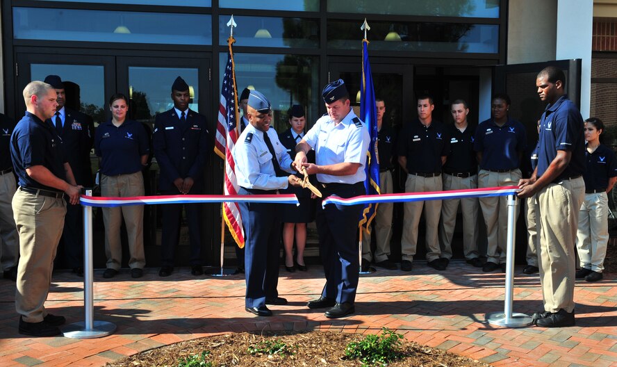 U.S. Air Force Lt. Col. Dalian Washington, 20th Force Support Squadron commander, and Col. Don Godier, 20th Fighter Wing vice commander, cut the ribbon to open the new fitness center addition at Shaw Air Force Base, S.C. Sept. 12, 2011. The new addition is approximately 25,000 sq. ft. and includes a new cardio room, weight room, and a men's locker room and a women's locker room. (U.S. Air Force photo by Airman 1st Class Amber E. N. Jacobs/Released)
