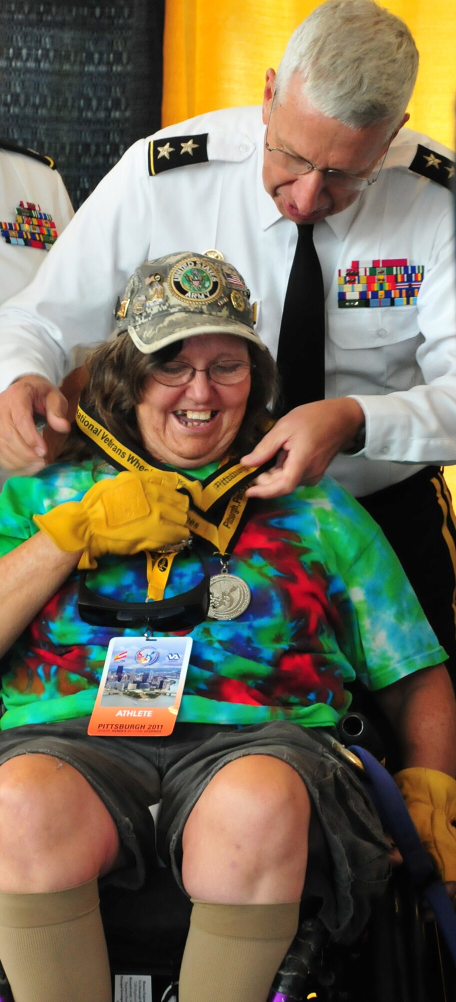 Maj. Gen. Wesley Craig, The Adjutant General of Pennsylvania, helps to award medal recipients during the 31st Annual National Veterans Wheelchair Games held in  Pittsburgh  August 1-6, 2011. (Air Force photo by Master Sgt. Ann Young/Released)