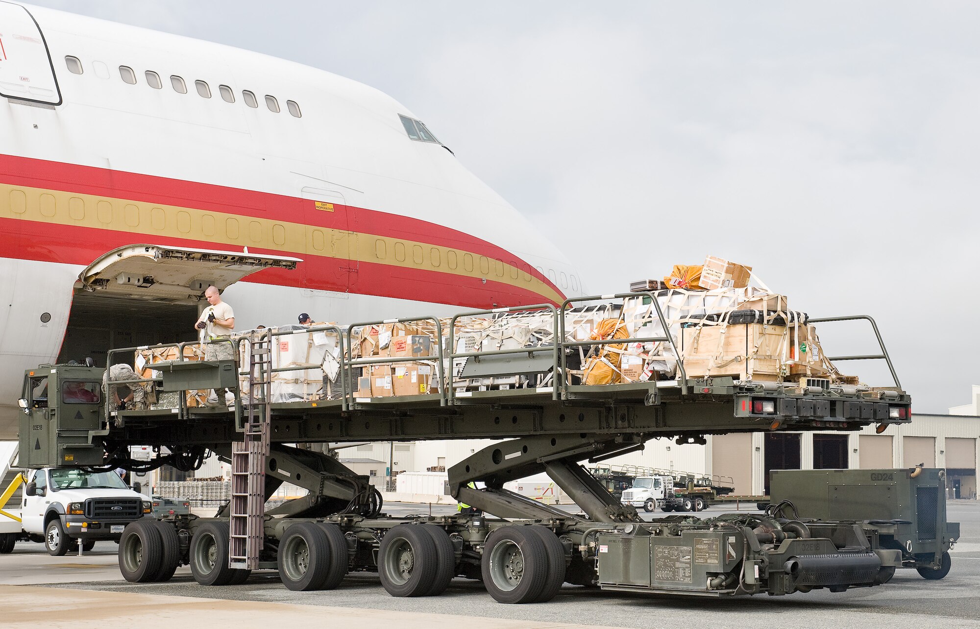 Ramp specialists with the 436th Aerial Port Squadron load more than 40,000 tons of cargo into a Boeing 747 Sept. 7, 2011, at Dover Air Force Base, Del. The 436 APS ramp services shop uses these cargo loaders to load and unload all planes flying to and from Dover AFB. (U.S. Air Force photo by Roland Balik)