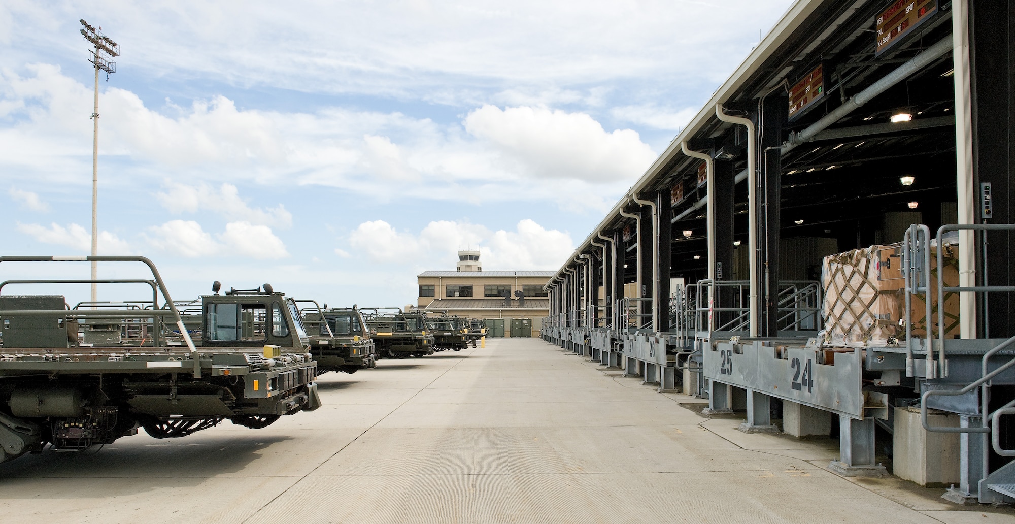 Sixty-thousand-ton aircraft cargo loaders sit outside the 436th Aerial Port Squadron’s warehouse Sept. 7, 2011, at Dover Air Force Base, Del. The 436 APS ramp services shop uses these cargo loaders to load and unload all planes processing to and from Dover AFB. (U.S. Air Force photo by Roland Balik)