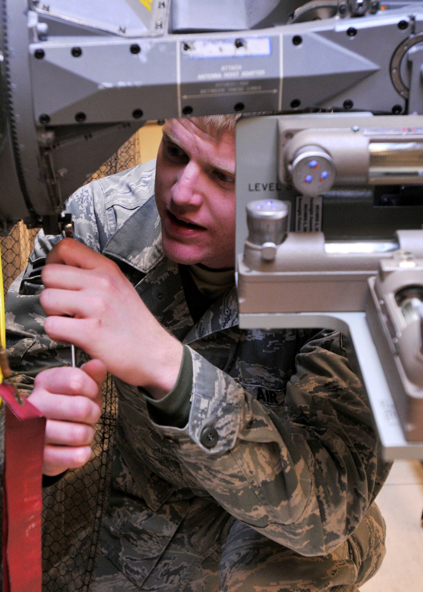 ROYAL AIR FORCE LAKENHEATH, England - Airman 1st Class Chance Bruno, 48th Component Maintenance Squadron Avionics Intermediate Section team member, practices boresight alignment on an F-15 radar antenna, in the Radar section of the 48th CMS Avionics Flight AIS building, Sept. 7, 2011.  AIS Airmen are responsible for providing the flightline with highly effective and efficient intermediate support to maintain the electronics on fighter aircraft. (U.S. Air Force photo by Senior Airman Tiffany M. Deuel)