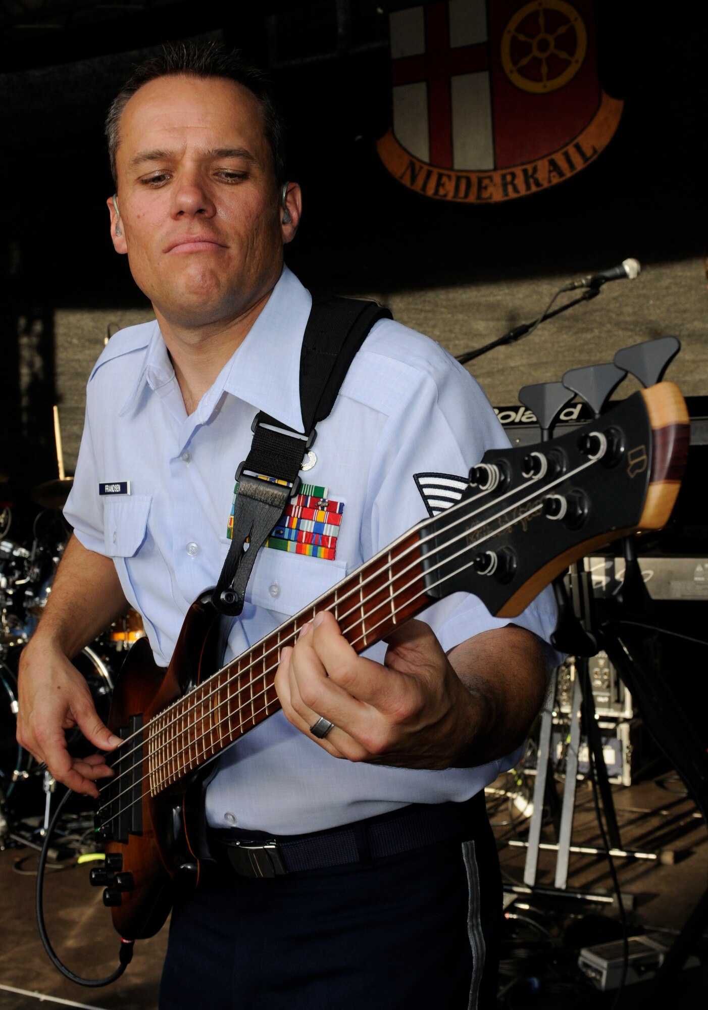 NIEDERKAIL, Germany -- Tech. Sgt. Mark Frandse, U.S. Air Forces in Europe band ‘Touch ‘n Go’ NCO-in-charge and bassist, performs at Niederkail’s 800th Anniversary Sept. 10 here. The band played rock, country, pop, and rhythm and blues hits as Spangdahlem Airmen and their families celebrated along with community members. (U.S. Air Force photo/ Senior Airman Natasha Stannard)
