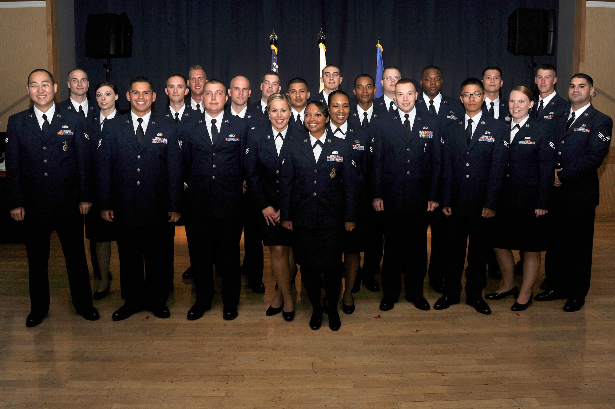 MISAWA AIR BASE, Japan - Airman Leadership Class 11-F graduates pose for a group photo in the collocated club at the conclusion of their graduation ceremony Sept. 8. Twenty-three students completed a five-week program covering group dynamics, military professionalism and time management. Staff Sgt. Nathan Lipscomb, 35th Fighter Wing was recognized as the John Levitow award winner, the pinnacle of achievements for Enlisted Professional Military Education. (U.S. Air Force photo/Tech. Sgt. Marie Brown)