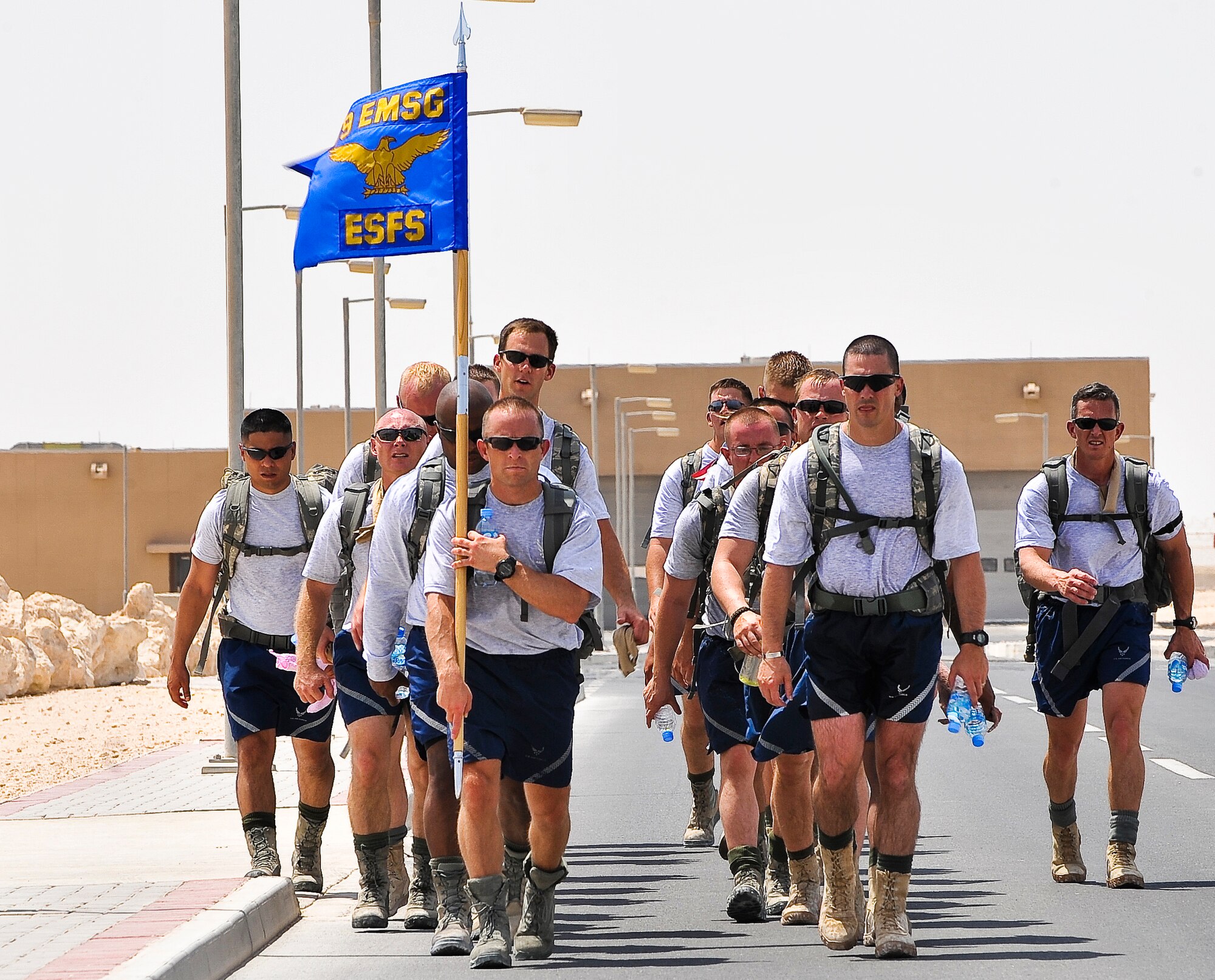 (Far right) Chief Master Sgt. Richard Parsons, U.S. Air Forces Central Command  Command Chief, marches with members of the 379th Expeditionary Security Force Squadron as they finish the final stretch of their 9.11-mile ruck march Sept. 11, 2011, at an undisclosed location in Southwest Asia. The march was one of three base-wide events to commemorate the nearly 3,000 people, including the 55 military members and 411 emergency personnel, who lost their lives 10 years ago in the tragic events of Sept. 11, 2001. (U.S. Air Force photo/Senior Airman Paul Labbe)