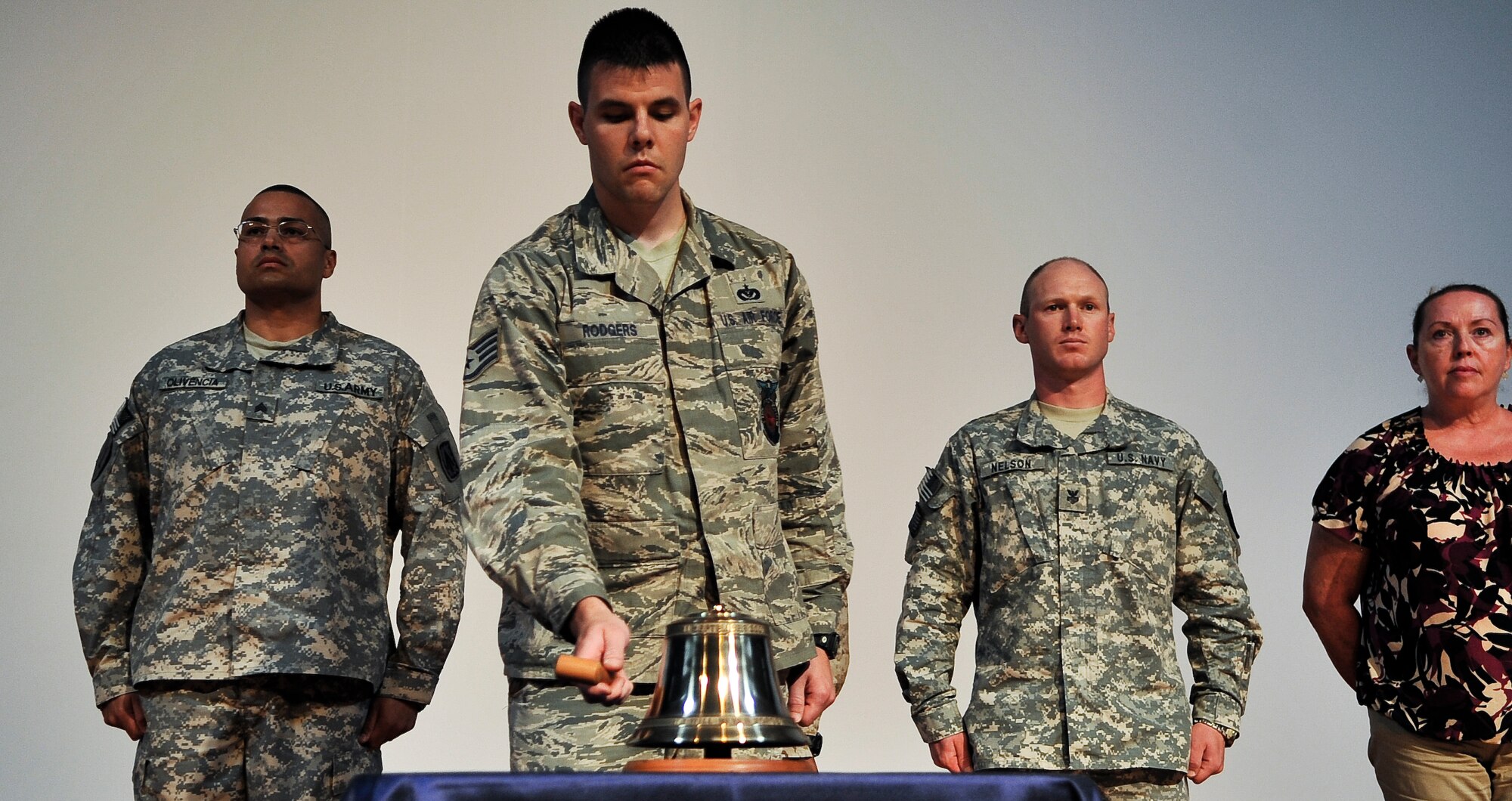 Staff Sgt. Glenn Rodgers, 379th Expeditionary Civil Engineer Squadron firefighter, strikes a ceremonial bell Sept. 11, 2011, during a commemoration ceremony at an undisclosed location in Southwest Asia. Rodgers, a native of Pittsburgh, Penn., is deployed from Hurlburt Field, Fla. (U.S. Air Force photo/Senior Airman Paul Labbe)