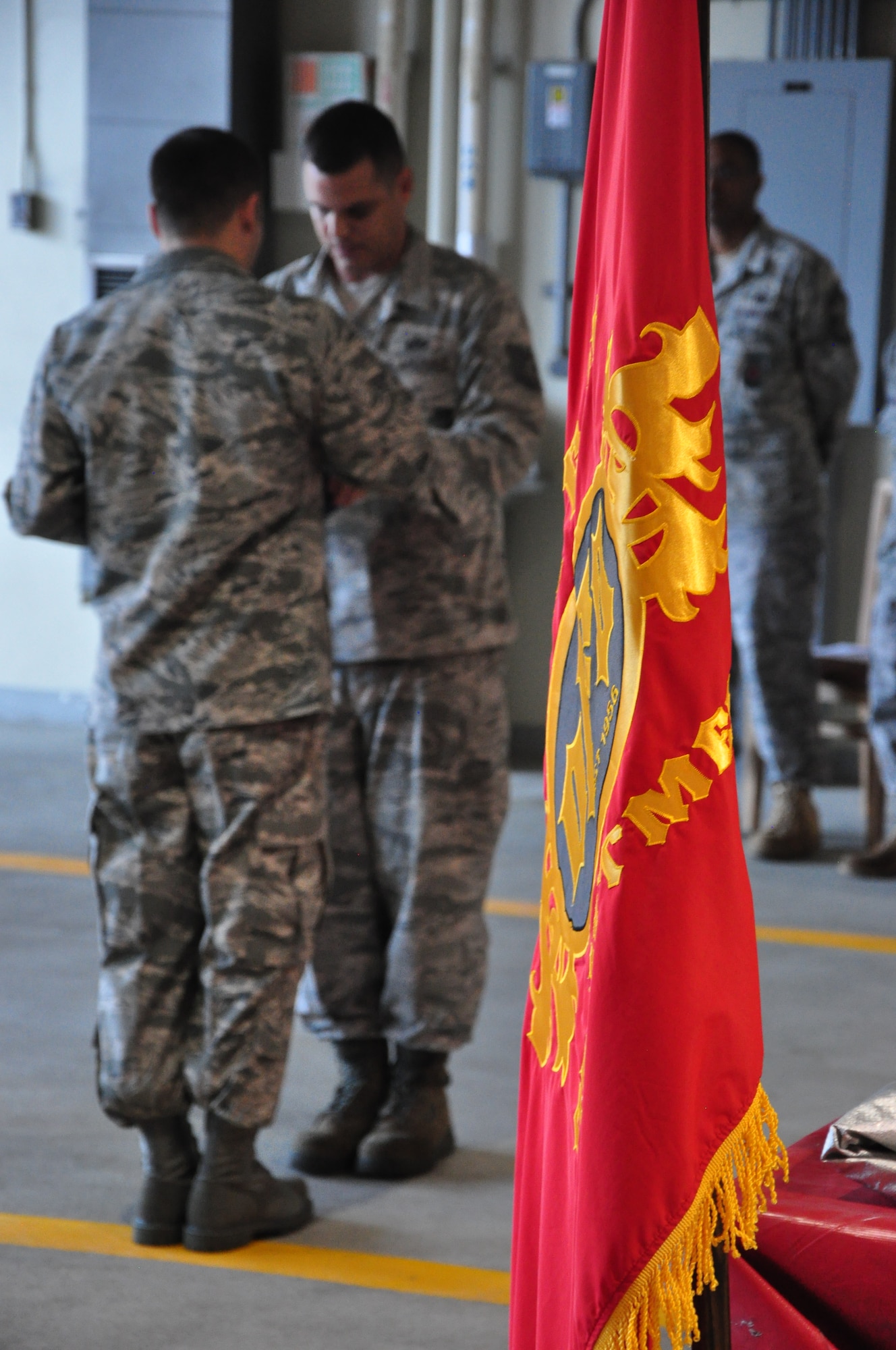 Senior Airman Dustin Boivin and Tech. Sgt. Justin Pederson, both firefighters with the 51st Civil Engineer Squadron, fold a flag Sept. 11, 2011 at Osan Air Base, Republic of Korea. “We will never forget,” is a phrase many Americans have heard thousands of times since Sept. 11, 2001, but for some the words go a bit deeper. The 51st CES fire department held a ceremony to remember and honor the firefighters who lost their lives that fateful day. (U.S. Air Force photo/Tech. Sgt. Chad Thompson)