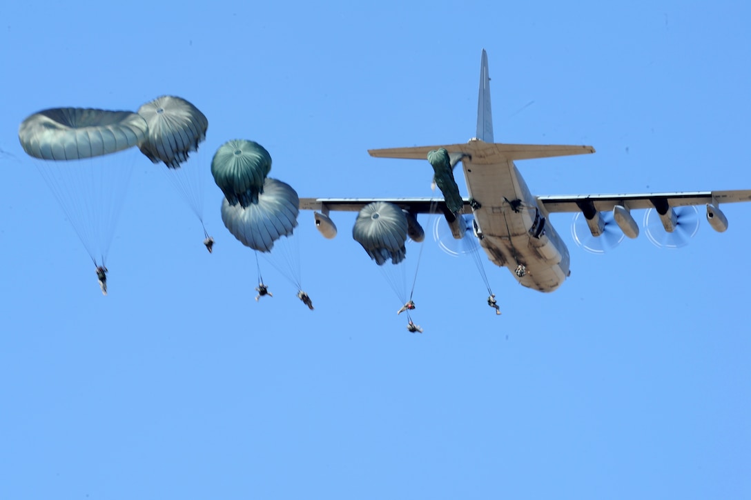 Army paratroopers make a static line jump over Edwards Air Force Base about 100 miles north of Los Angeles, Sept. 11, 2011.