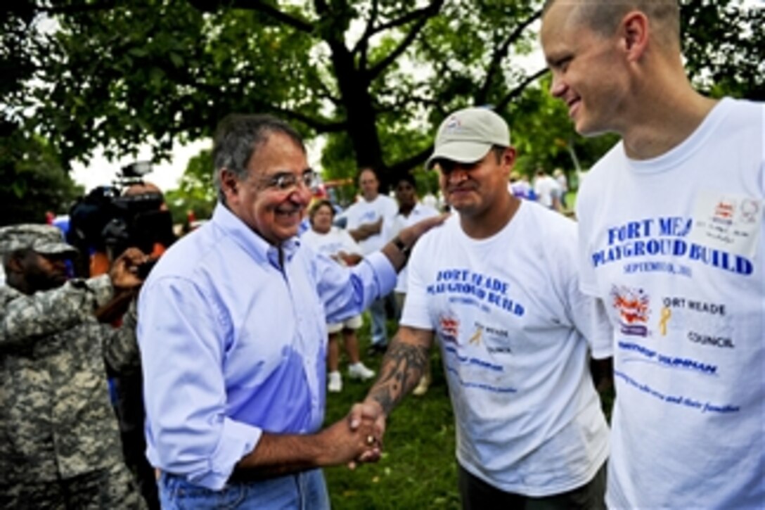 Secretary of Defense Leon E. Panetta meets with veterans and service members who volunteered their time during the 9/11 National Day of Service and Remembrance by joining volunteer organizations Blue Star Families and Kaboom to help build a playground for military children on Fort George G. Meade, Md., on Sept. 10, 2011.  