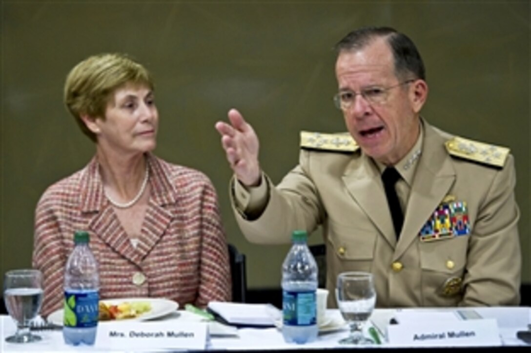 Deborah Mullen and Navy Adm. Mike Mullen, chairman of the Joint Chiefs of Staff, address business and civic leaders at a breakfast before a town hall meeting at the University of Miami in Coral Gables, Fla., Sept. 13, 2011.
