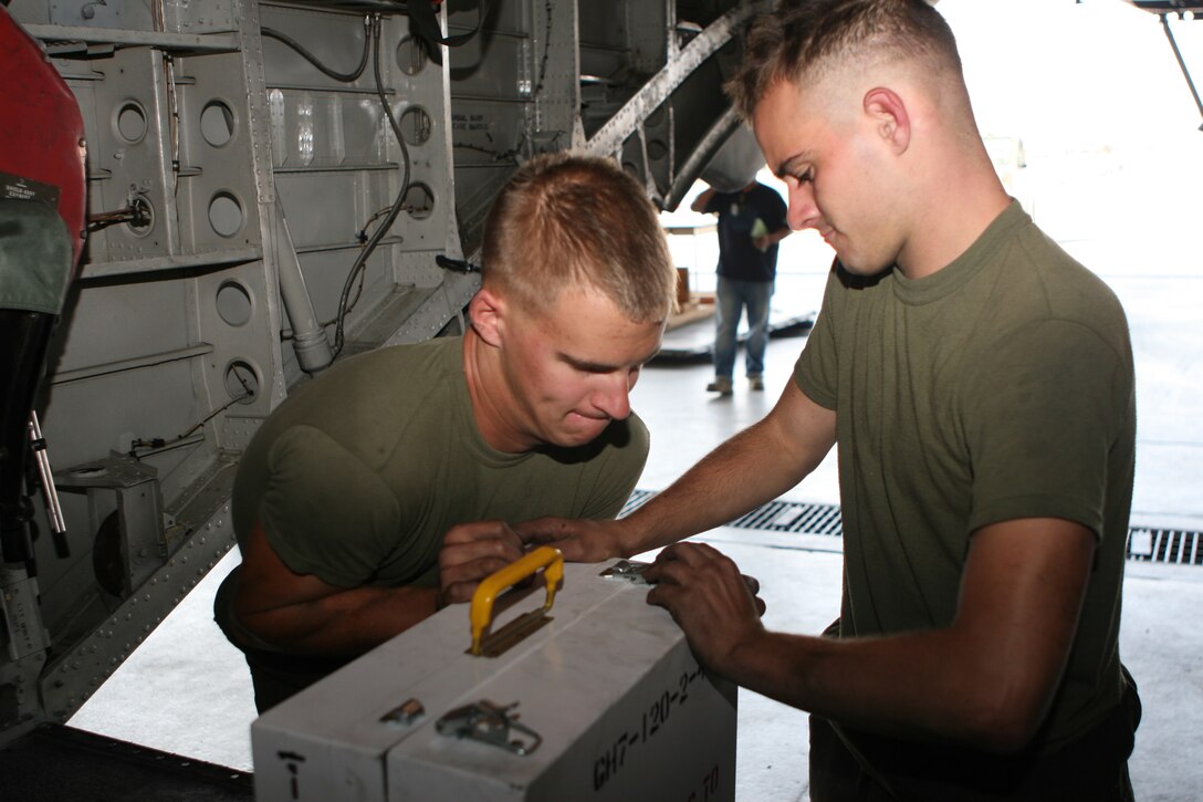 Lance Cpl. Dylan S. Melancon, left, an airframe mechanic with Marine Heavy Helicopter Squadron 361 and a Breaux Bridge, La., native, works with Lance Cpl. Derek J. Arnold, right, a fellow airframe mechanic with HMH-361 and a Seattle native, to close a tool box after an accountability check Sept. 13. An all tools accounted for check, also known as an ATF, is performed at the beginning and end of each work day by all maintenance crew members.