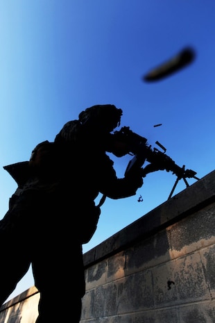 A Marine of Weapons Platoon, Charlie Company, 1st Battalion, 2nd Marine Regiment, breach a building while conducting Military Operations in Urban Terrain training at the Urban Assault Course on Fort Pickett, Va., Sept. 13. More than 900 Marines and sailors are taking part in the Deployment for Training exercise at Fort Pickett, Sept. 6-23. The battalion is scheduled to attach to the 24th Marine Expeditionary Unit as its Battalion Landing Team a few days after the training.