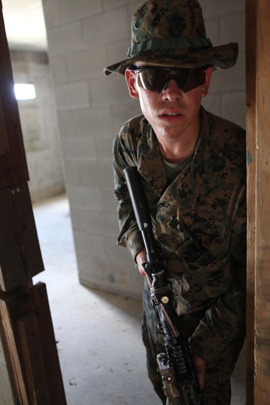 Lance Cpl. Joshua Schinlaub, a fireteam leader, with 1st Platoon, Charlie Company, 1st Battalion, 2nd Marine Regiment, prepares to maneuver to his next objective during Military Operations in Urban Terrain training at the Urban Assault Course on Fort Pickett, Va., Sep. 13, 2011. More than 900 Marines and Sailors are taking part in the Deployment for Training exercise at Fort Pickett, Sept. 6-23. The battalion is scheduled to attach to the 24th Marine Expeditionary Unit as its Battalion Landing Team a few days after the training.