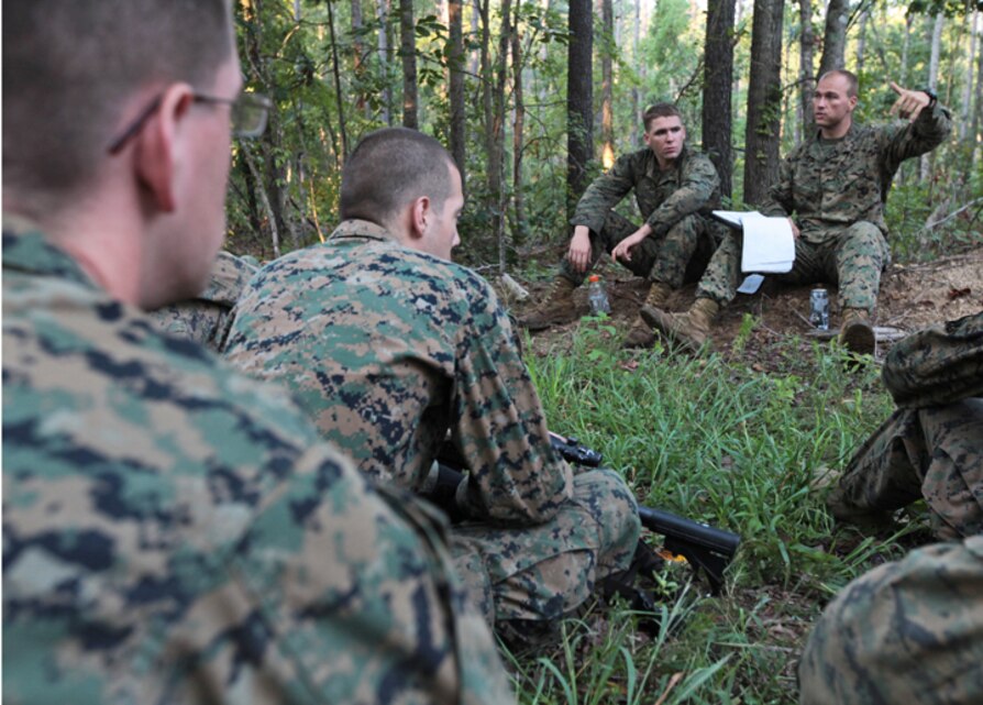 Cpl. Michael Bassett, a scout sniper with 1st Battalion, 2nd Marine Regiment, 2nd Marine Division, teaches a class about patrolling to non-infantry Marines aboard Fort Pickett, Va., September 14. The class was part of an ongoing effort for the Marines to learn basic infantry tactics on top of their actual Military Occupational Specialties.