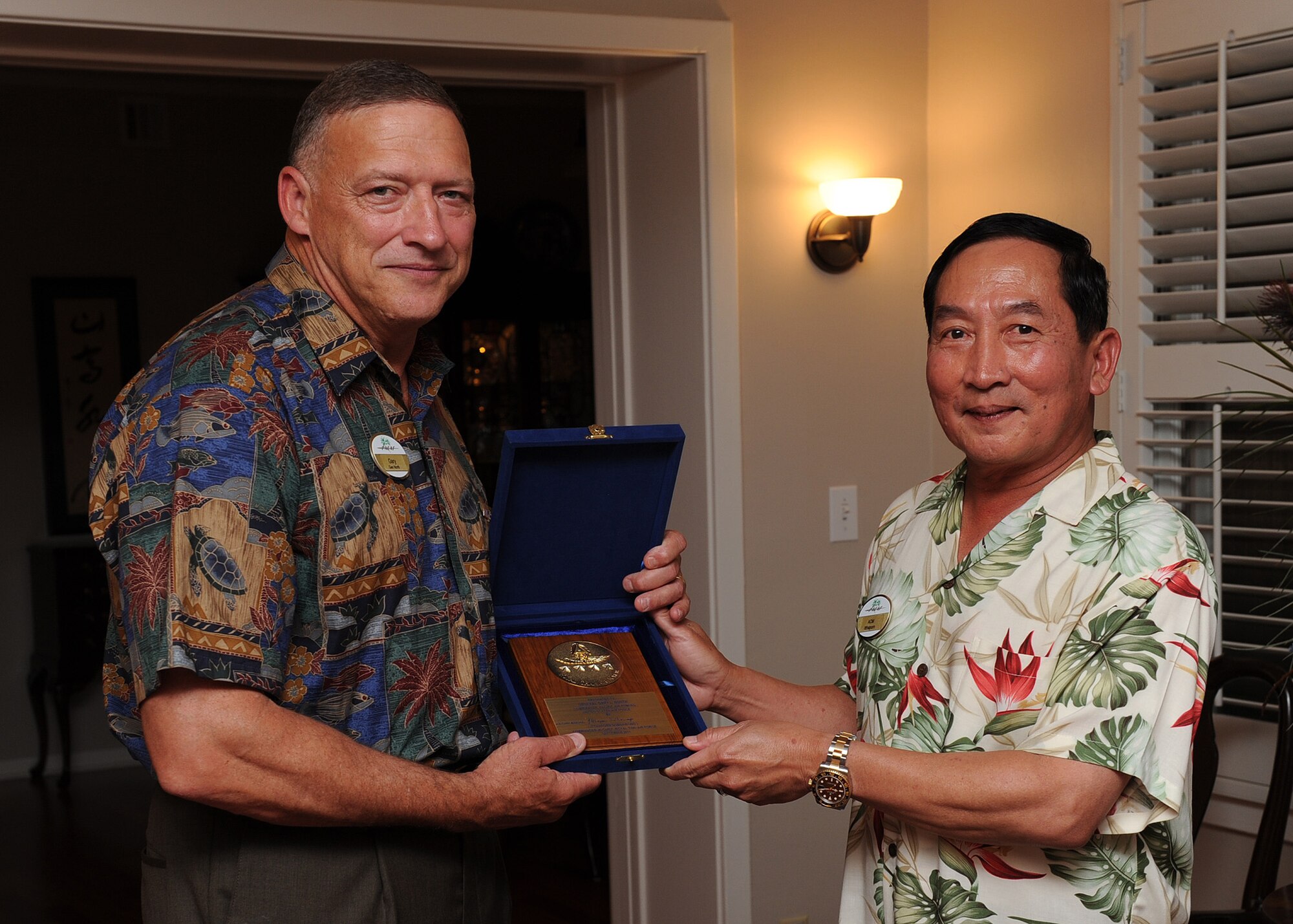Air Chief Marshal Itthaporn Subhawong, Commander-in-Chief of the Royal Thai Air Force, presents a special plaque to General Gary North, Pacific Air Forces commander, at Hale Ali’I, Joint Base Pearl Harbor-Hickam, Hawaii, Sept. 8.  Air Chief Marshal Itthaporn visited Hawaii to meet with General North and senior leaders of PACAF to discuss common concerns and explore opportunities to strengthen regional cooperation. (U.S. Air Force photo/Tech. Sgt. Jerome S. Tayborn (Released))
