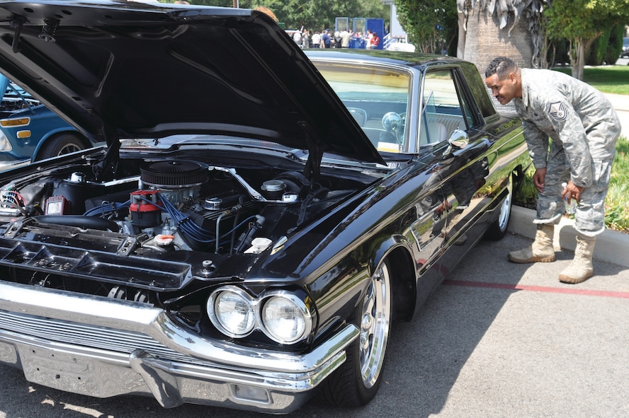 Master Sgt. Darryl Heisser, 452 SFS, takes a look at a custom 1965 Ford Thunderbird at the car show at the 39th Annual Military Appreciation Picnic at March Air Reserve Base, Calif., Sept. 10, 2011.  The picnic is held each year during the combined unit training assembly weekend.  (U.S. Air Force photo/ Staff Sgt. Megan Crusher)