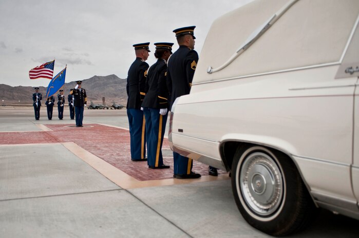 Nevada Army National Guard Sgt. Maj. Ronald Mose, salutes U.S. Army Spc. Dennis James Jr., as his remains are transported from Nellis Air Force Base Nev., Sept. 13, 2011. James was deployed to Afghanistan from the 10th Mountain Division at Fort Polk, La. when he was killed by an improvised explosive device, Aug. 31, 2011. (U.S. Air Force photo by Tech. Sgt. Michael R. Holzworth/Released)