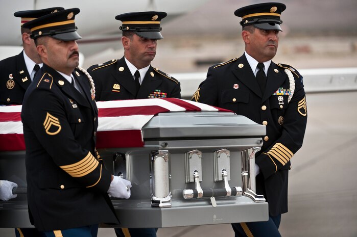 Soldiers from the Nevada Army National Guard carry the casket of U.S. Army Spc. Dennis James Jr., on the Nellis Air Force Base Nev., flightline Sept. 13, 2011. James was deployed to Afghanistan from the 10th Mountain Division at Fort Polk, La. when he was killed by an improvised explosive device, Aug. 31, 2011. James will be entered into the Southern Nevada Veteran Memorial Cemetery Sept. 26, 2011 at Boulder City, Nev. (U.S. Air Force photo by Tech. Sgt. Michael R. Holzworth/Released)